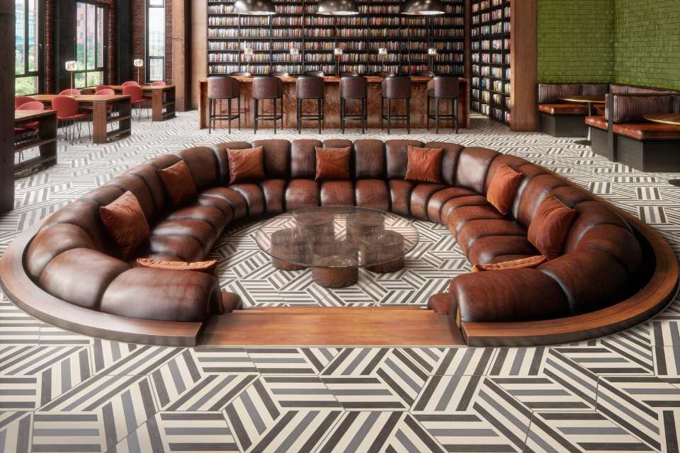 retro black and white tile in bar with sunken leather seating area